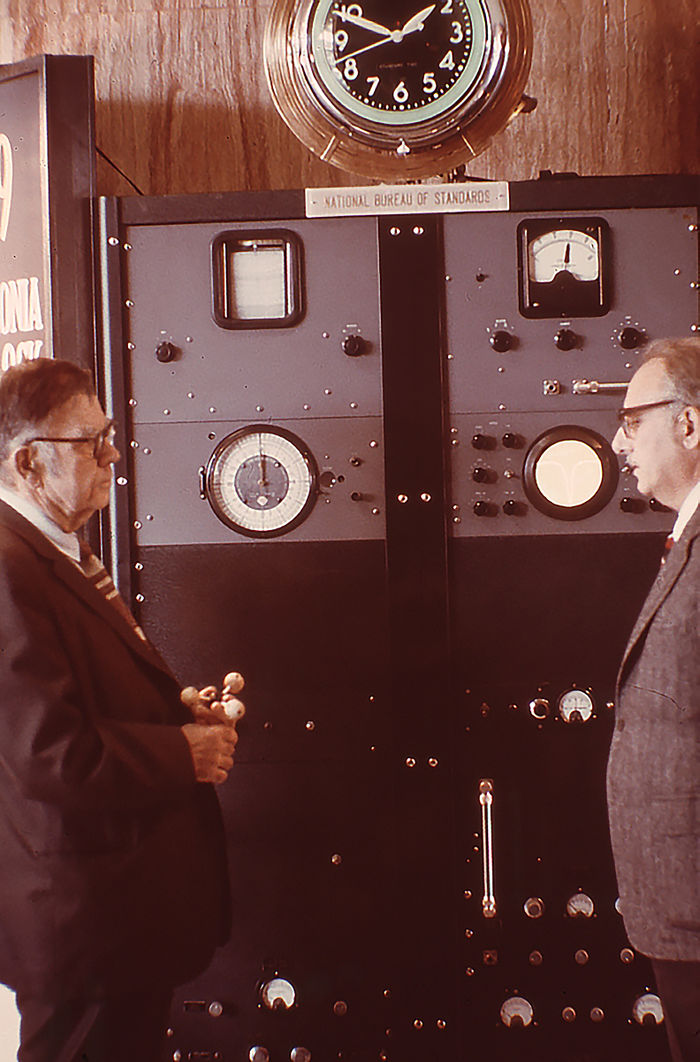Condon (left) and Lyons (right) with Atomic Clock on 25th anniversary