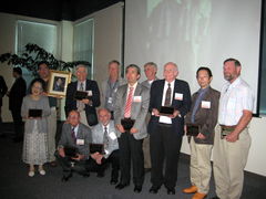 The plaques held by the honorees in the photo are "Vinyl wood plaque" style